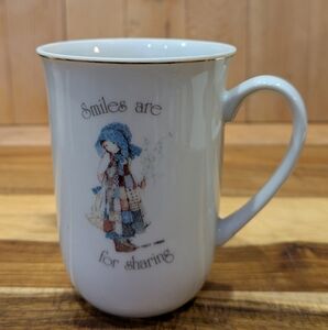 White Ceramic Mug with Blue and Brown Design